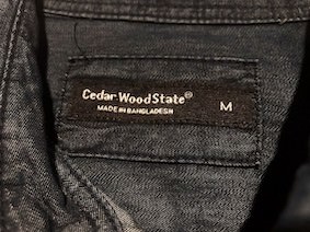 Border label sewed on a dark grey shirt